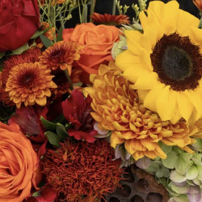 Bouquet of sunflowers, roses, and orange chrysanthemums