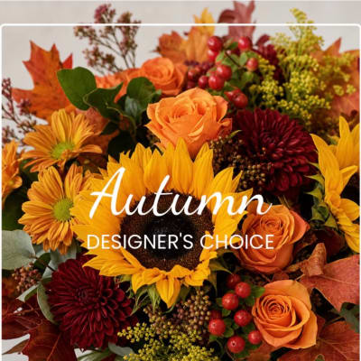Autumn bouquet with orange roses, sunflowers, and burgundy mums