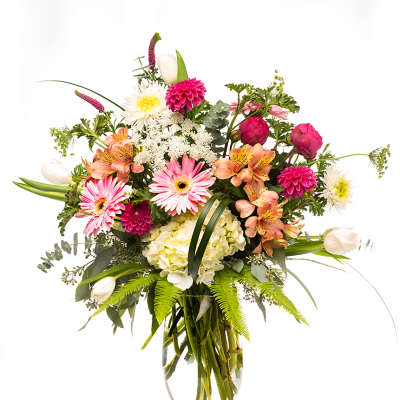Mixed pink and white bouquet in a clear glass vase