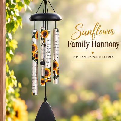 Sunflower-themed wind chime hanging outdoors with printed text