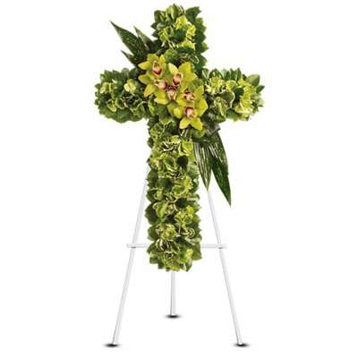 Green floral cross on a white stand