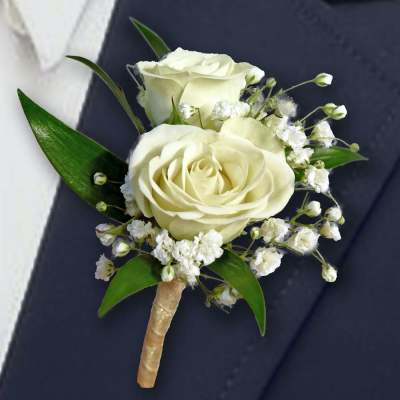 White rose boutonniere with baby's breath and green leaves