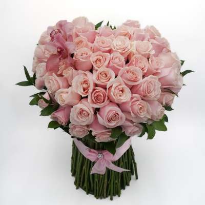 Bouquet of pale pink roses with pink orchids and a pink ribbon wrap