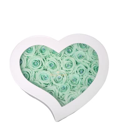 Heart-shaped box filled with mint green roses