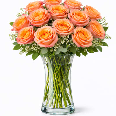 Bouquet of peach roses in a clear glass vase