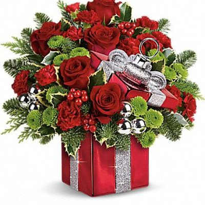 Red roses and carnations in a gift box with silver ribbon