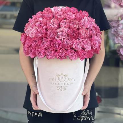 Large pink rose bouquet in a white hatbox with ribbon handles