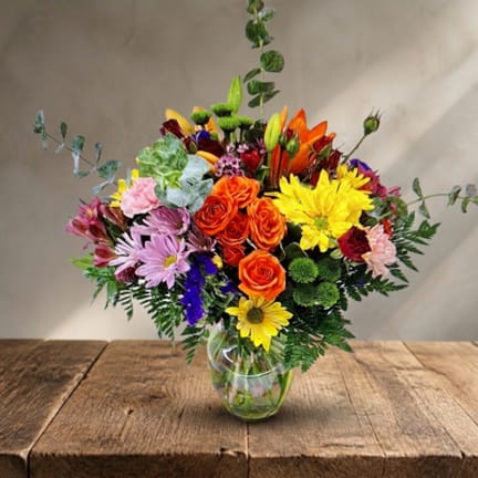 Colorful mixed bouquet in a clear glass vase