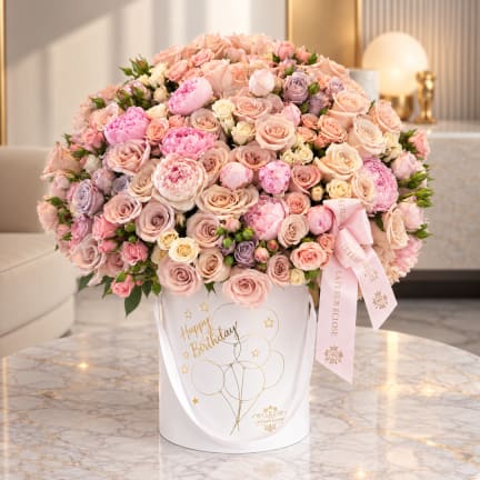 Large pink and peach rose bouquet in a white birthday box