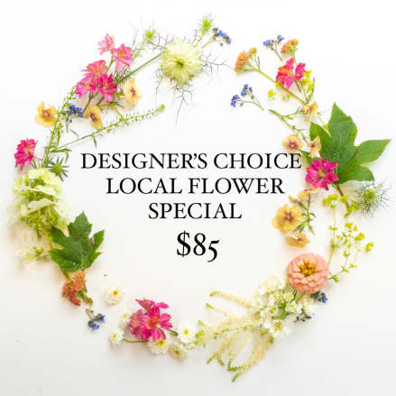 Assorted small pink, yellow, and white flowers arranged in a loose circular frame around text on white background
