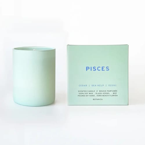 Mint green scented candle beside its matching box