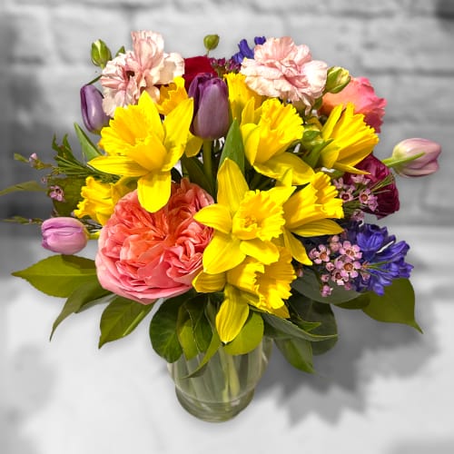 Colorful mixed bouquet in a clear glass vase