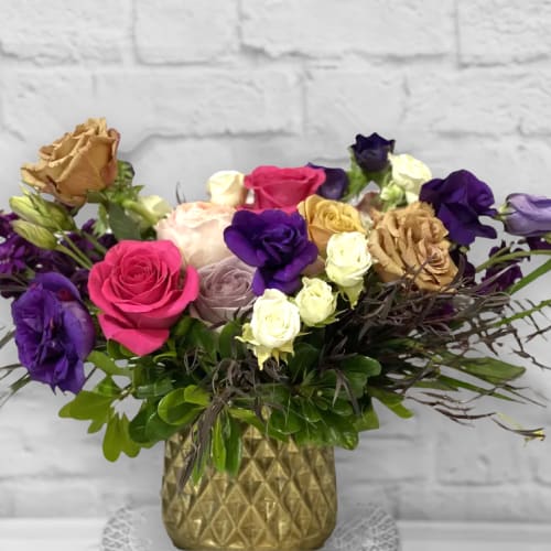 Mixed roses in a gold textured vase