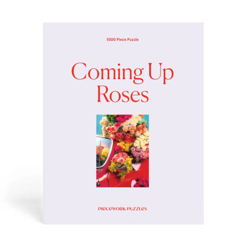 Box for a 1000-piece puzzle with a rose-covered car on the cover