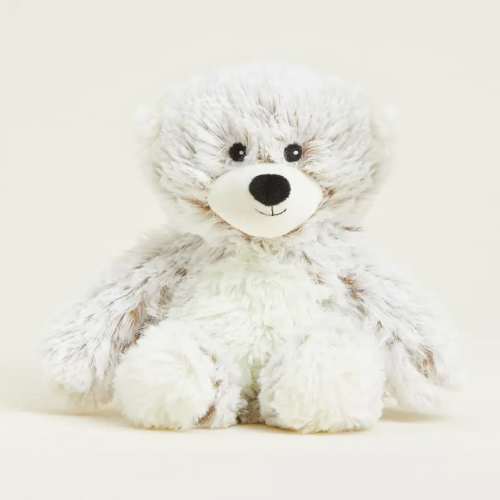 White plush teddy bear with black eyes and nose