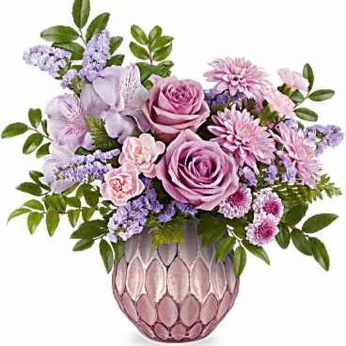 Lavender and pink bouquet in a textured pink vase