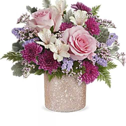 Pink roses and purple flowers in a glittery vase
