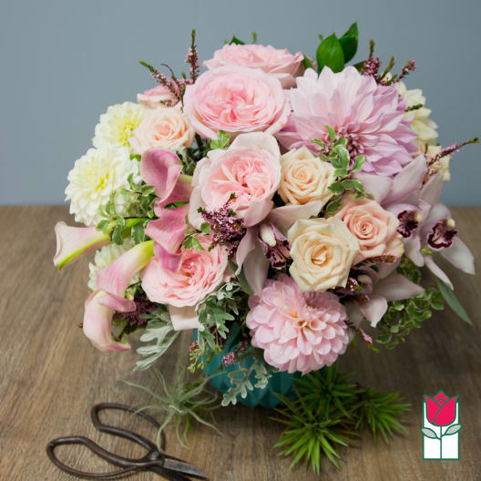Pink and cream bouquet with roses, dahlias, and calla lilies