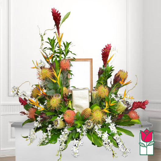 Tropical floral arrangement with red ginger, bird of paradise, and white orchids