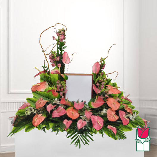 Pink and coral anthurium arrangement with tall pink spikes and greenery