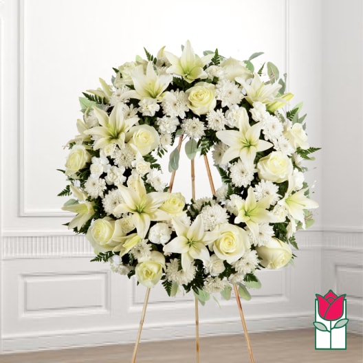 White floral wreath on a standing easel