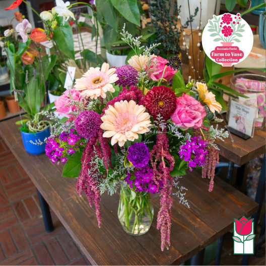 Mixed pink and purple bouquet in a clear glass vase