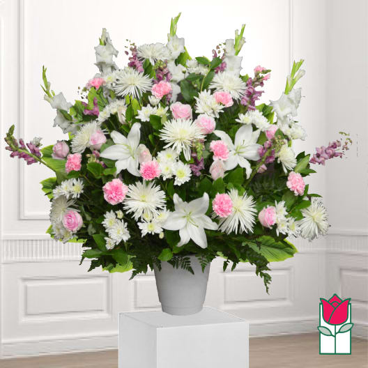 Large white and pink floral arrangement in a gray vase