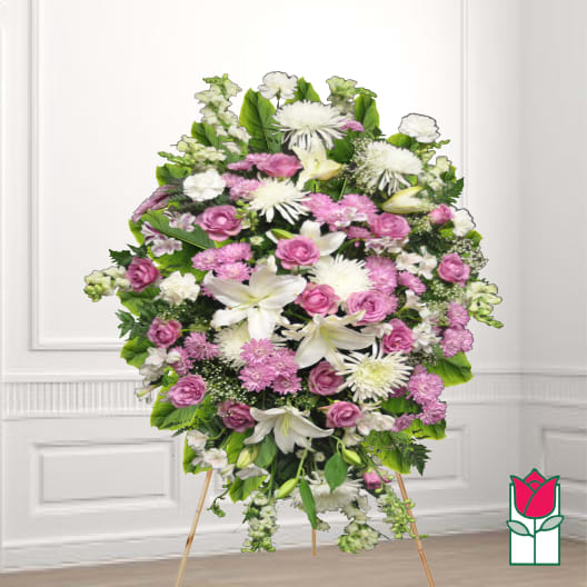 Standing floral spray with pink roses, white lilies, and white chrysanthemums