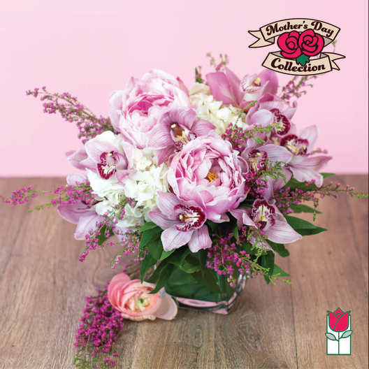Pink and white floral arrangement in a glass vase