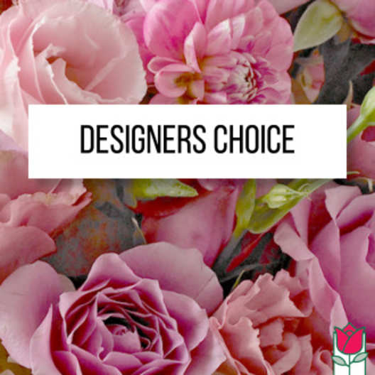 Pink roses and peony-like blooms behind a Designers Choice label