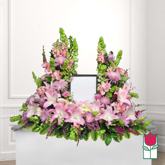 Pink and white floral wreath with lilies and chrysanthemums