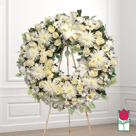 White floral wreath on a standing easel