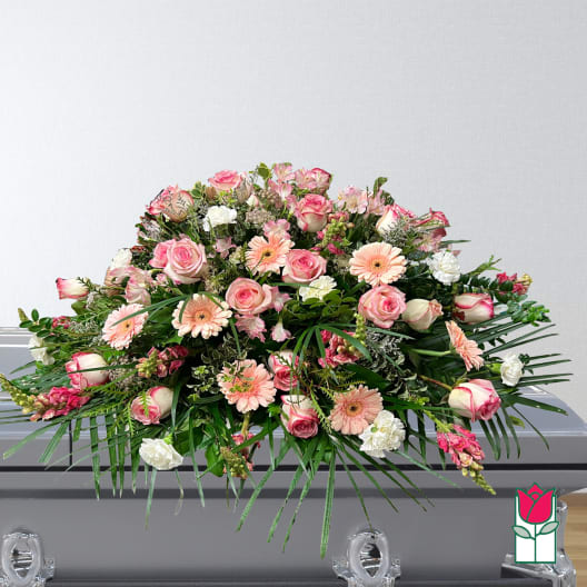 Large pink and white floral casket spray with roses and gerbera daisies
