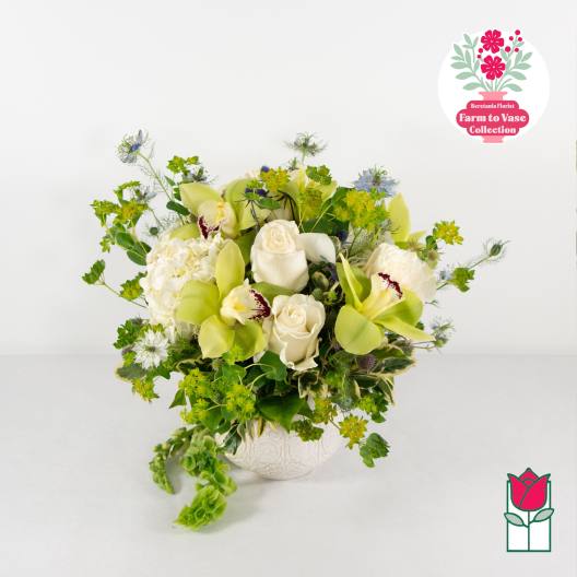 White and green floral arrangement in a decorative vase