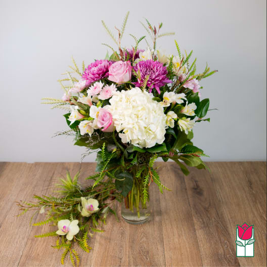 Pink and white mixed bouquet in a glass vase