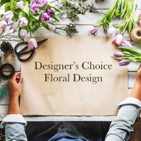 Designer’s Choice Floral Design sign surrounded by tulips and floral supplies