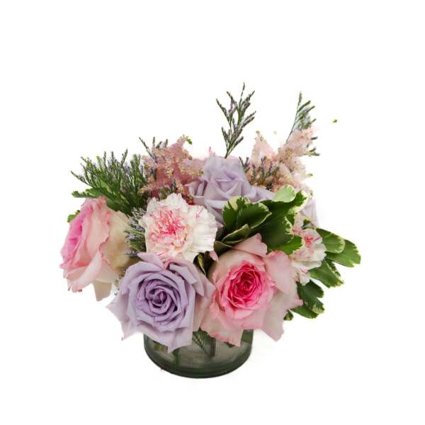 Bouquet of pink and lavender roses in a glass vase
