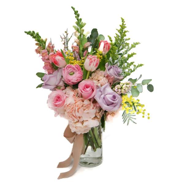 Pink and lavender bouquet in a clear glass vase