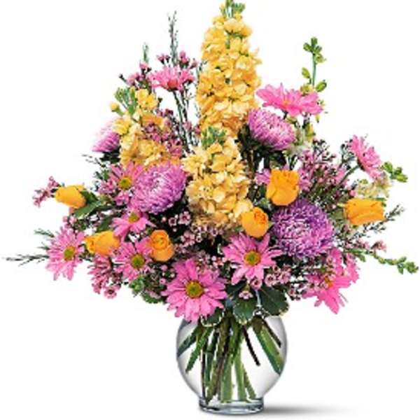 Pink and yellow mixed bouquet in a clear glass vase