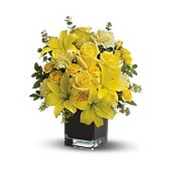 Yellow floral arrangement in a black square vase