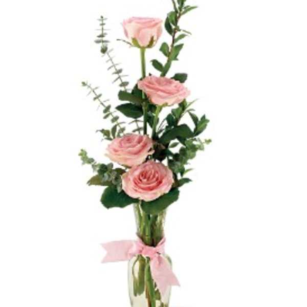 Pink roses in a clear glass vase with a pink ribbon