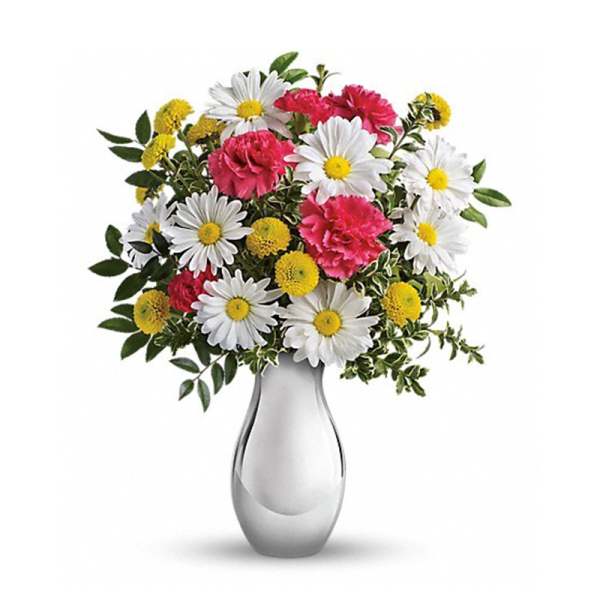 Bouquet of white daisies, pink carnations, and yellow button flowers in a silver vase