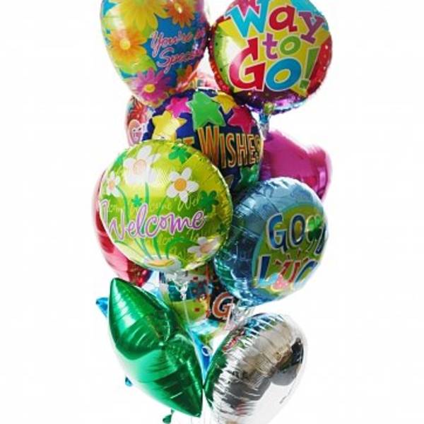 Cluster of colorful foil balloons with cheerful messages