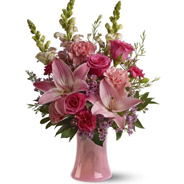 Pink lilies and roses arranged in a pink vase