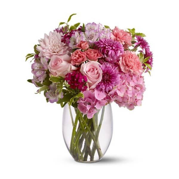 Pink and purple mixed bouquet in a clear glass vase