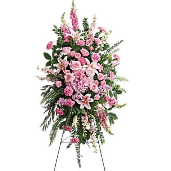Tall pink floral standing spray on an easel