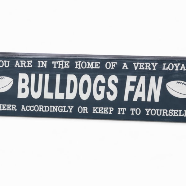 Wooden sign reading "Bulldogs Fan" with football graphics