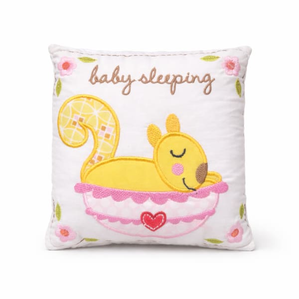 Embroidered baby sleeping pillow with a yellow squirrel in a bowl