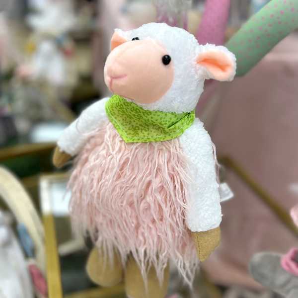 Plush sheep figurine with a green scarf and pink fuzzy body