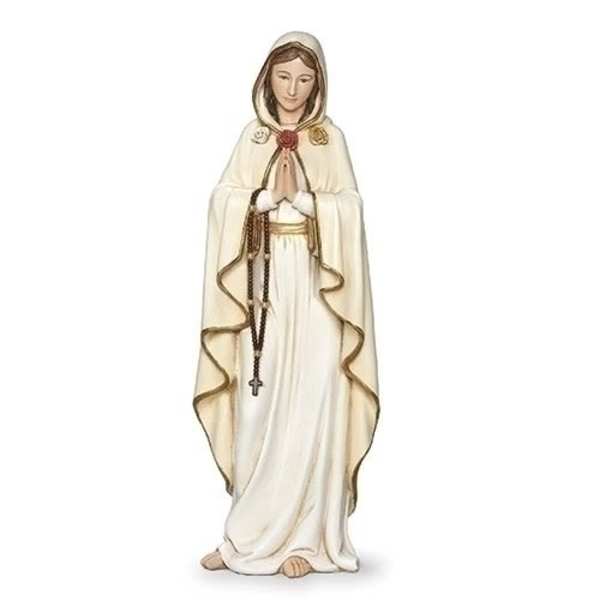 A cream-colored religious statue of a woman holding a rosary.